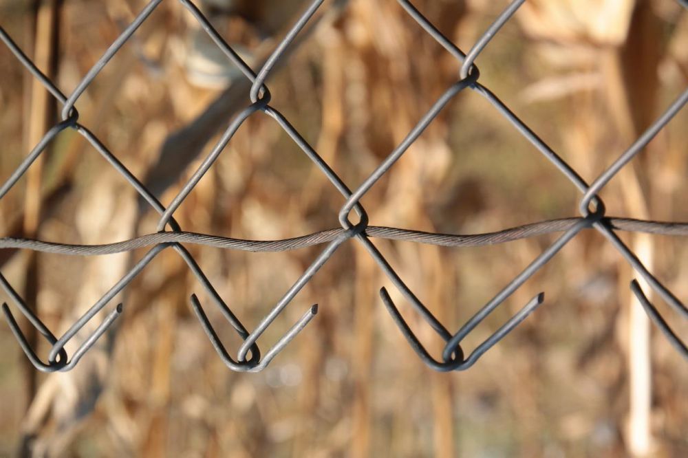 How to Secure a Chain Link Fence at the Bottom
