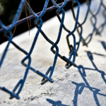 How to Fix a Chain Link Fence That Is Curling Up